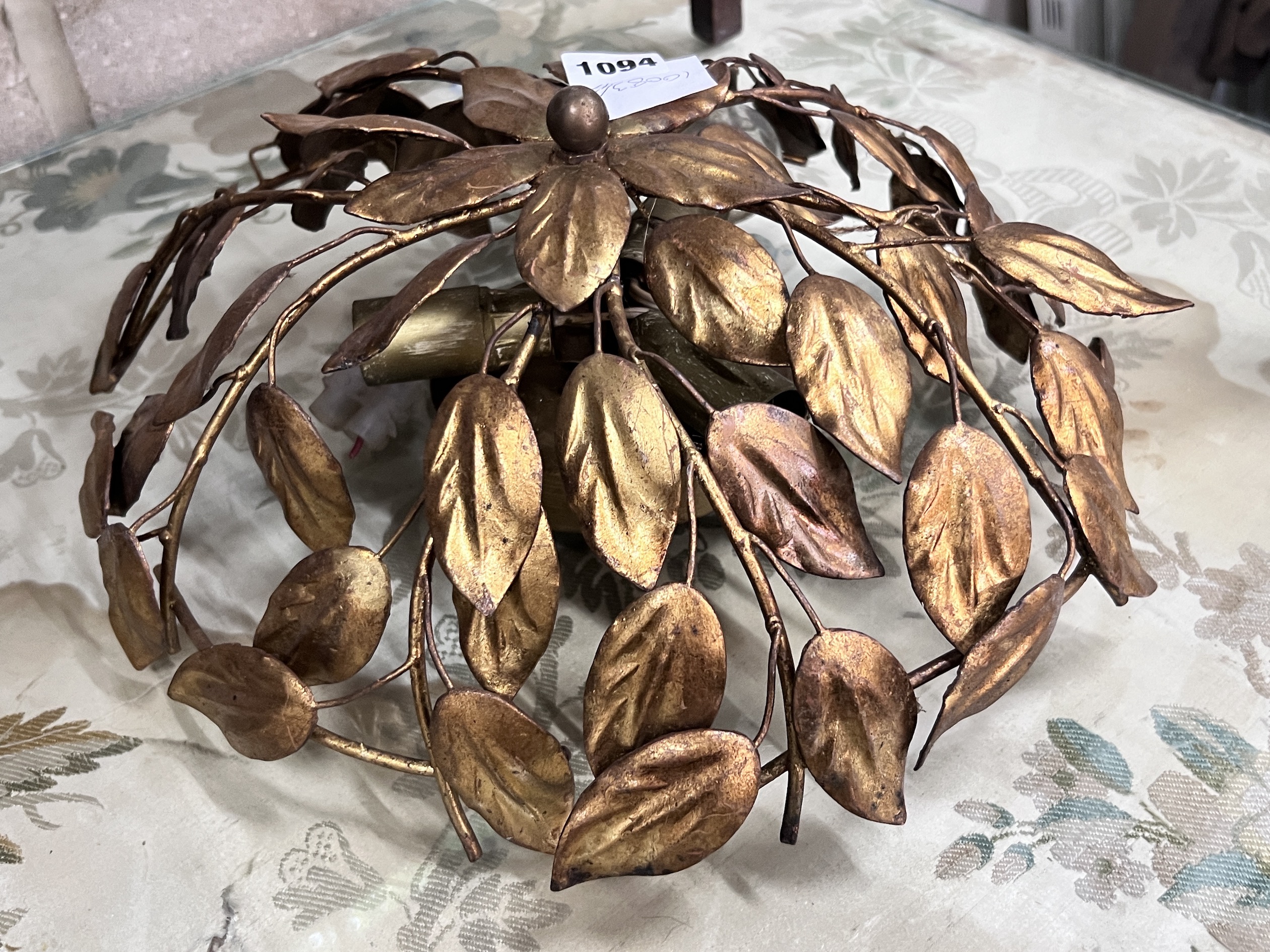 A gilt metal ceiling shade